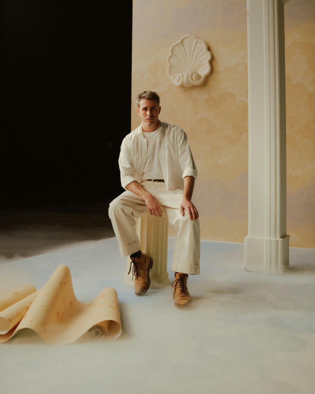 A showcase of Painted Sky wall coverings design with Xavier Donnelly in the foreground