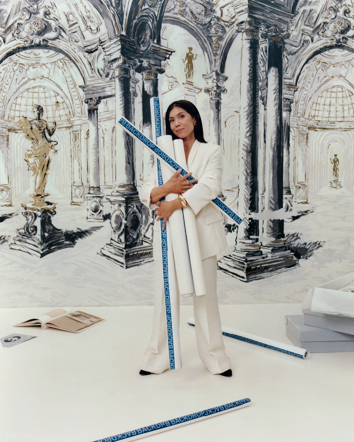 Backdrop Founder, Natalie Ebel, stands in front of installed PALAZZO PANEL SET from ARCHIVE by BACKDROP