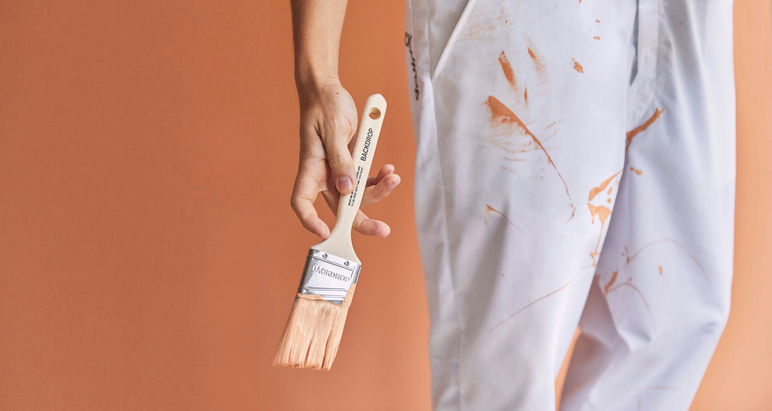 A person holding a paint brush